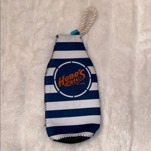 Bottle holder with bottle opener on the back